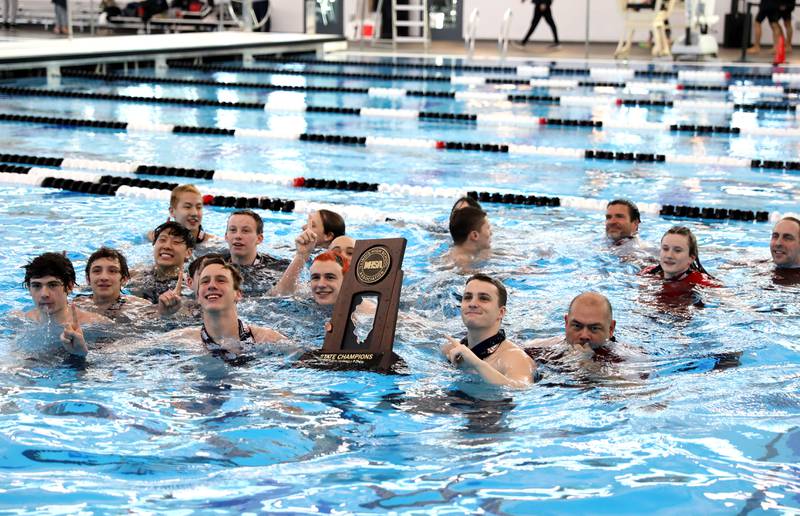 Hinsdale Central swimmers celebrate their first-place finish in the IHSA Boys State Championships at FMC Natatorium in Westmont on Saturday, Feb. 25, 2023.