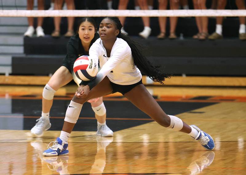 Sycamore's Khiara Thomas receives a serve during their match against DeKalb Wednesday, Aug. 28, 2024, at DeKalb High School.