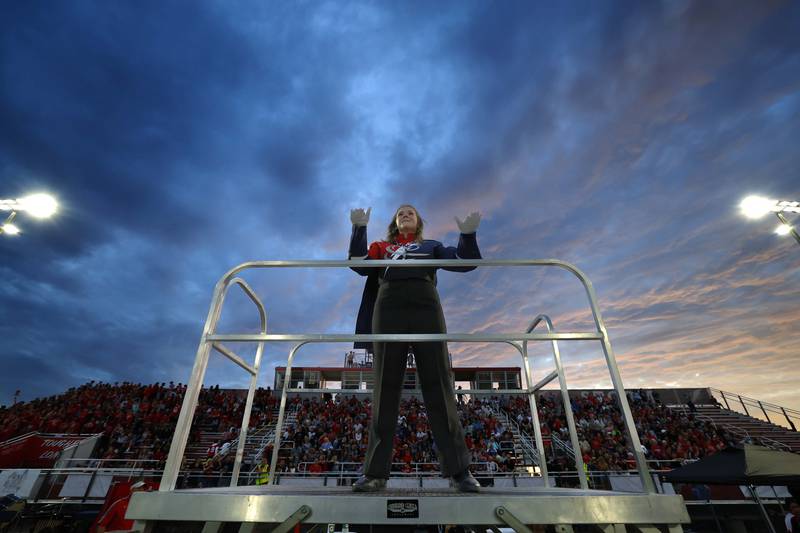 Sixteen-year-old Drum Major Hannah Greenberg leads the South Elgin band in the National Anthem Friday, Aug. 30, 2024 in South Elgin.