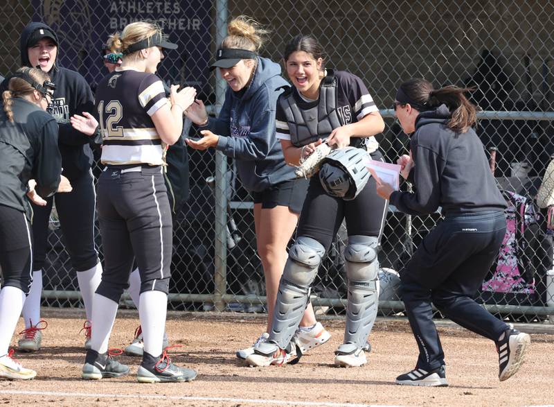 Sycamore softball head coach Jill Carpenter gets her team fired up before their game against Sterling Tuesday, May 14, 2024, at Sycamore High School.