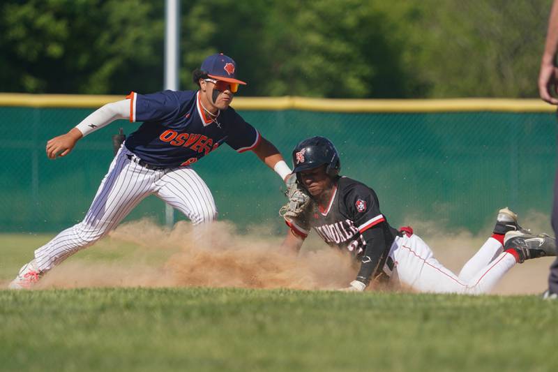 Hinsdale Central's Brayan Hernandez (26) doubles after beating the tag at second base by Oswego’s Gabriel Herrera (8) during a Class 4A Waubonsie Valley Regional semifinal baseball game at Waubonsie Valley High School in Aurora on Wednesday, May 22, 2024.