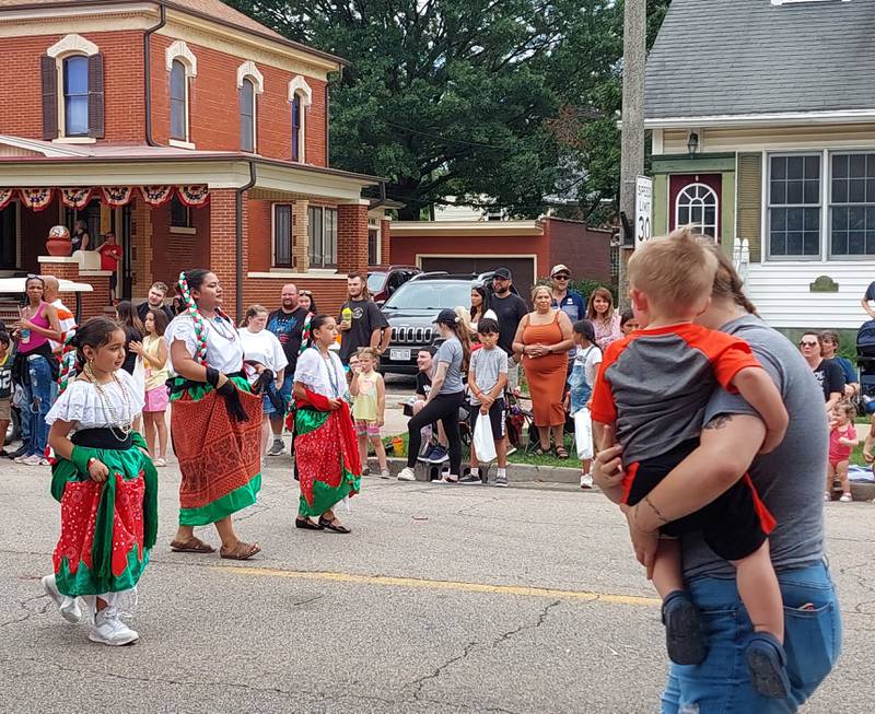 The Ballet Folklorico de Colores dancers make their way along the Mendota Sweet Corn Festival parade route Sunday, Aug. 13, 2023.