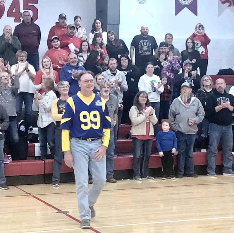 Brian Blumhorst, father of LaMoille coach Chance Blumhorst and DePue coach Trae Blumhorst, tossed a ceremonial jump ball before Friday's game in LaMoille.