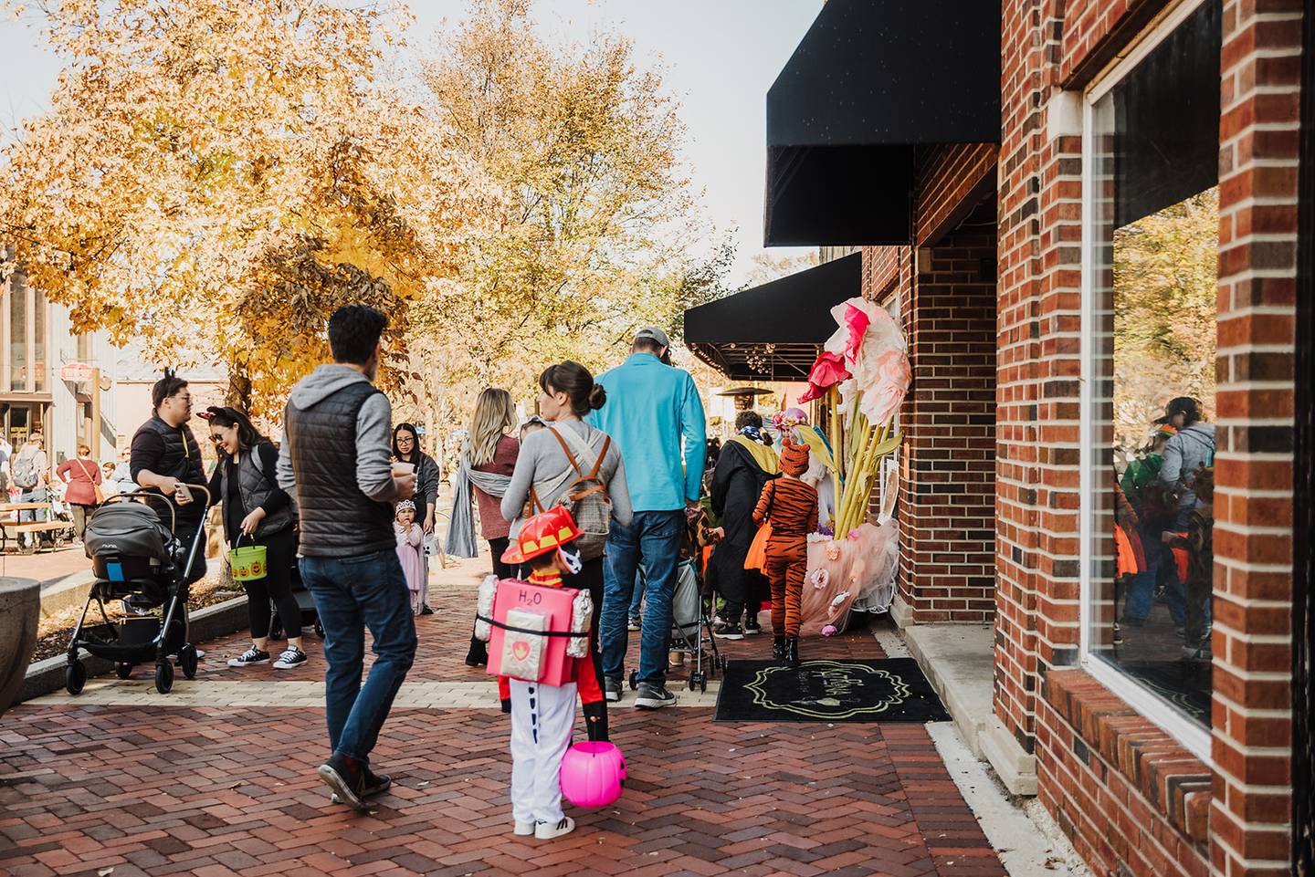 Families venture through downtown Batavia during the 2022 BatFest. The 2024 celebration will feature a costume parade, face painting and more.