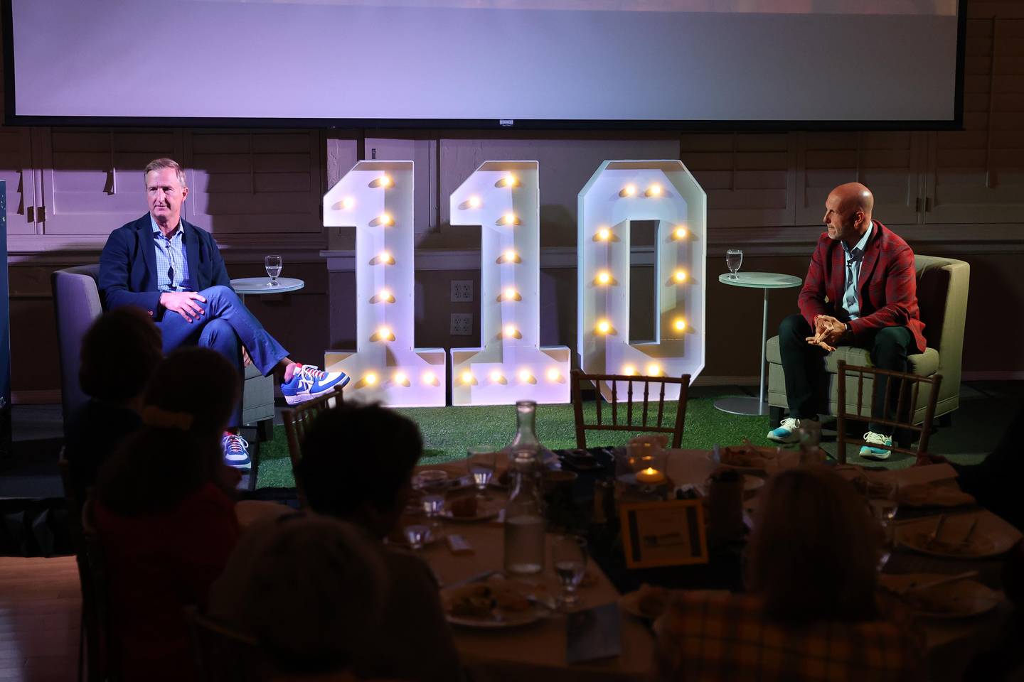 Chicago Cubs President of Business Operation Crane Kenney,left, and Radio personality and sports columnist David Kaplan speak at the Joliet Region Chamber of Commerce 110th Anniversary luncheon on Tuesday, Sept. 10, 2024 at the Renaissance Center in Joliet.