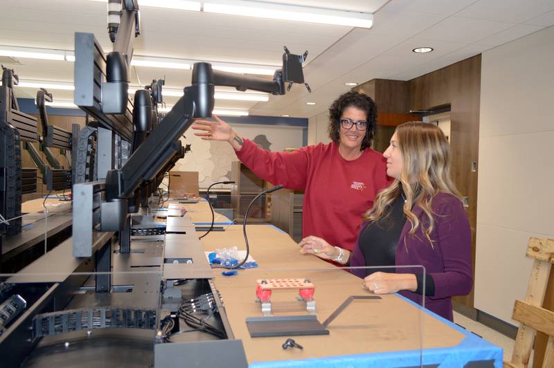 Whiteside County Dispatch Director Stacie McKinzie, left, and Assistant Dispatch Director Jess Liston look at one of the unfinished desks in the new dispatch center in Morrison on June 27, 2024. In late September, all Whiteside County dispatchers will move to the new center.