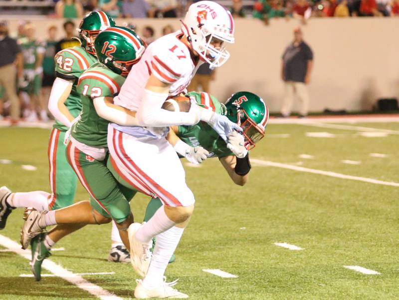 Ottawa's Owen Sanders runs with the ball as he is brought down behind from L-P's Rylynd Rynkewicz on Friday, Sept. 13, 2024 at Howard Fellows Stadium.