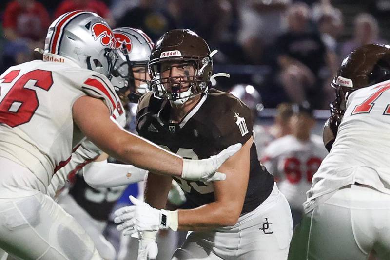 Joliet Catholic’s Ian Campbell locks in on the play against Iowa City on Friday, August 30, 2024 in Joliet.