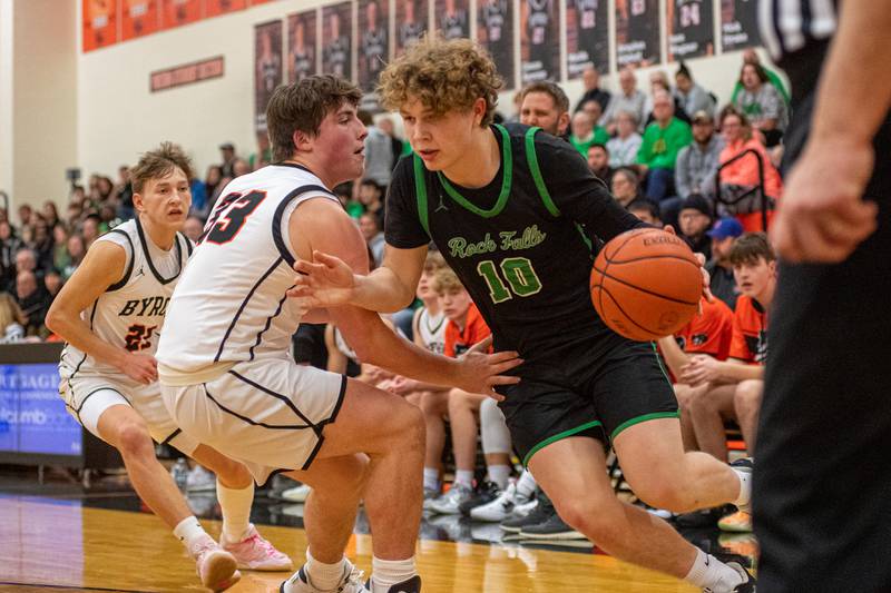 Rock Falls' Kuitim Heald drives past Byron's Caden Considine during the second quarter of the 2A Byron Regional championship game on Saturday, Feb. 25, 2023.