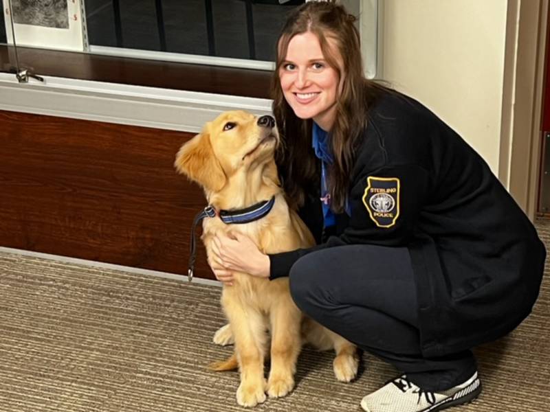 Sterling police officer Mary Toth and Millie are shown at the Sterling Police Department's training room on Monday, Aug. 19, 2024.