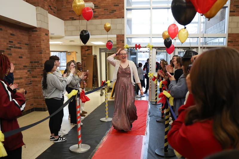 Sarah Lopez walks the red carpet at the annual Special Population Dance hosted by Joliet West high school on Friday, March 22, 2024.