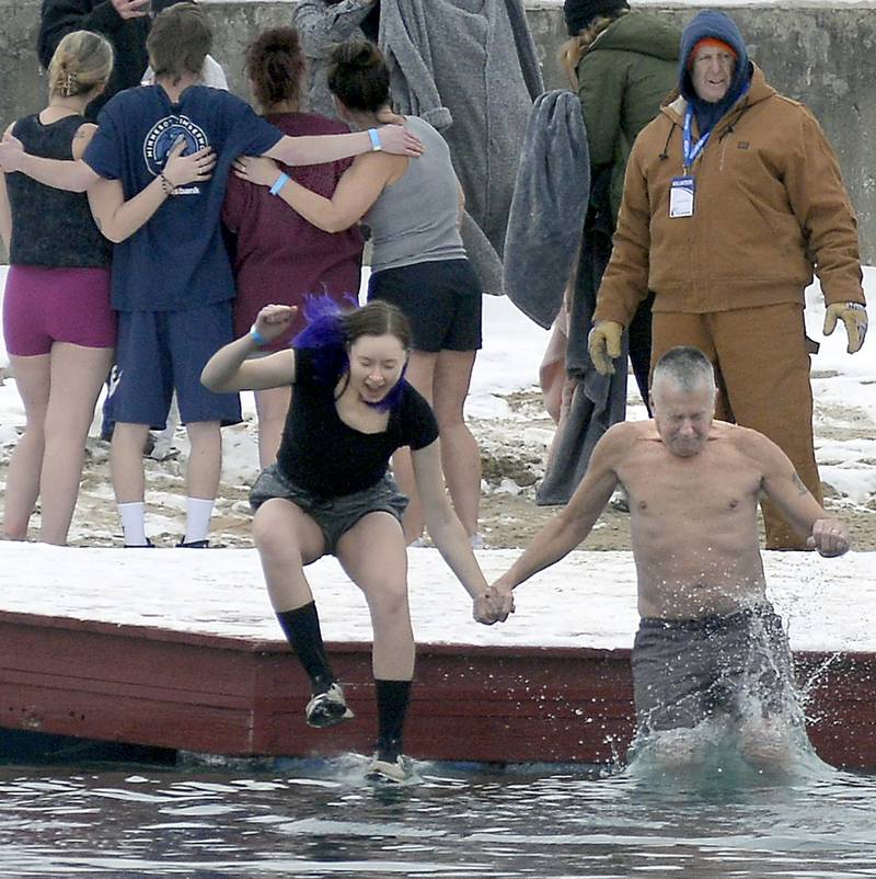 The cold weather didn’t stop anyone Saturday, Jan. 28, 2023, from jumping into the lake north of Ottawa at Skydive Chicago. A hundred plungers at Skydive Chicago came together to raise more than $52,000 and counting. Donations will be accepted to March 1.