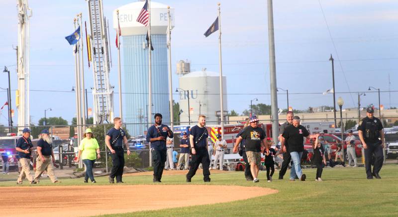 First responders are introduced onto the field before the Illinois Valley Pistol Shrimp game during first responder night on Tuesday, June 11, 2024 at Schweickert Stadium in Peru.