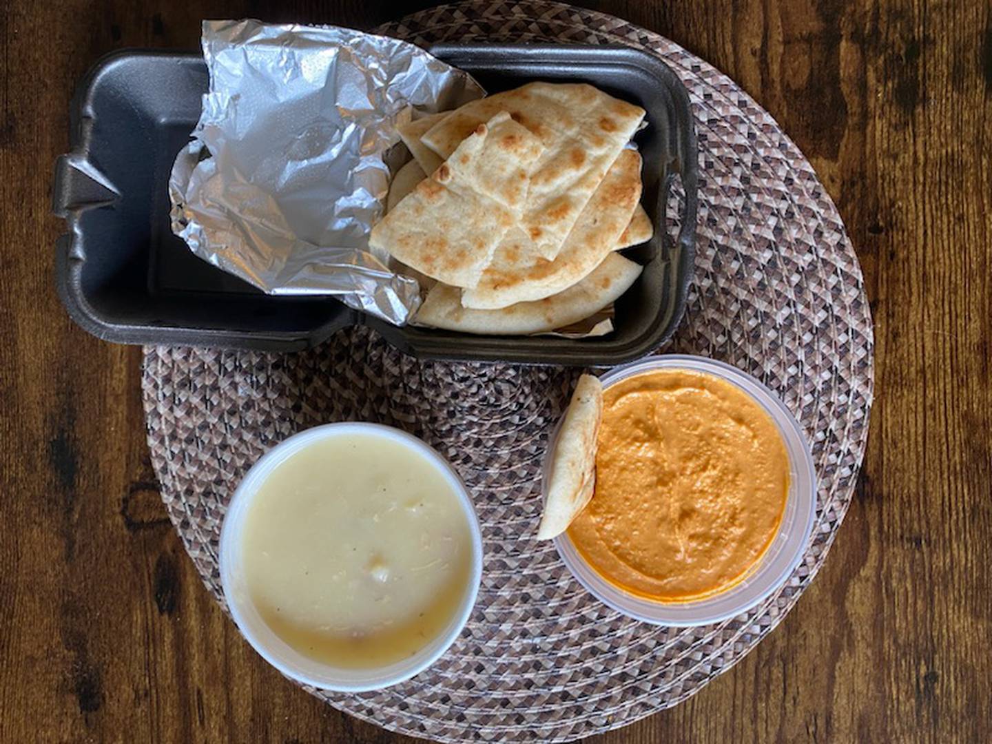 The classic pita brea and hummus was ordered from The Village authentic Greek restaurant, 418 W. State St. in downtown Sycamore. Also shown is the cup of avgolemono soup which was served as a side for the spinach pie entree. The soup is a Greek-style chicken lemon soup.