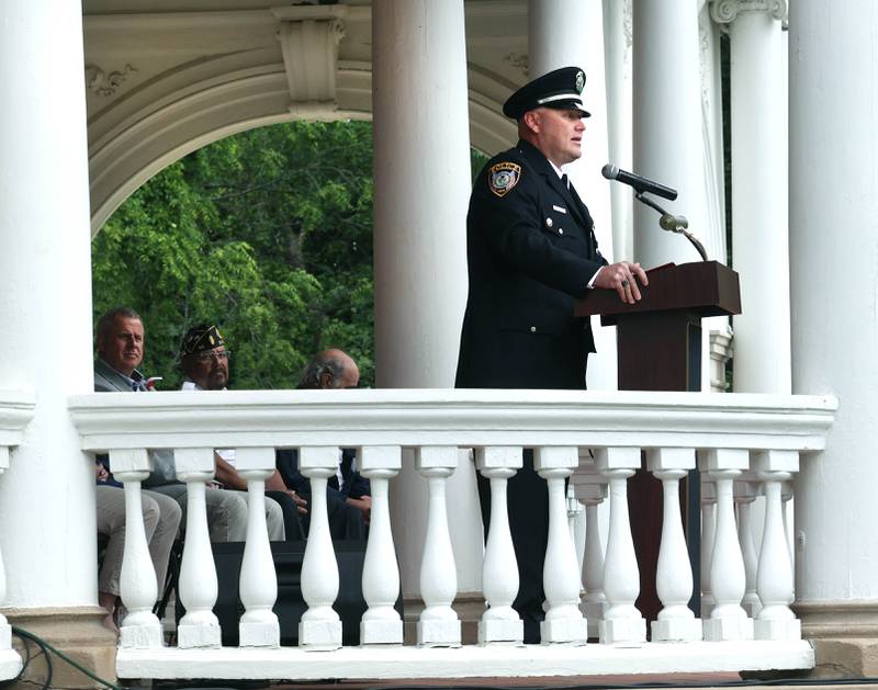 Keynote Speaker Jason Goodwin, a U.S. Marine Corps veteran and DeKalb police sergeant, makes his remarks Monday, May 27, 2024, during the DeKalb Memorial Day program at Ellwood House.