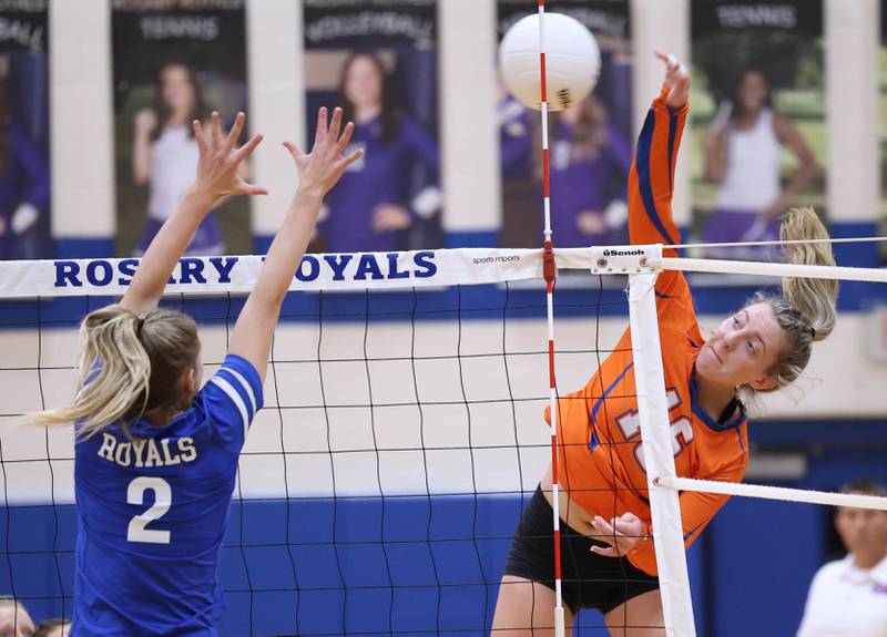 Genoa-Kingston's Alayna Pierce tries to spike the ball past Rosary's Lily Caruso during their Regional semifinal match Tuesday, Oct. 25, 2022, at Rosary High School in Aurora