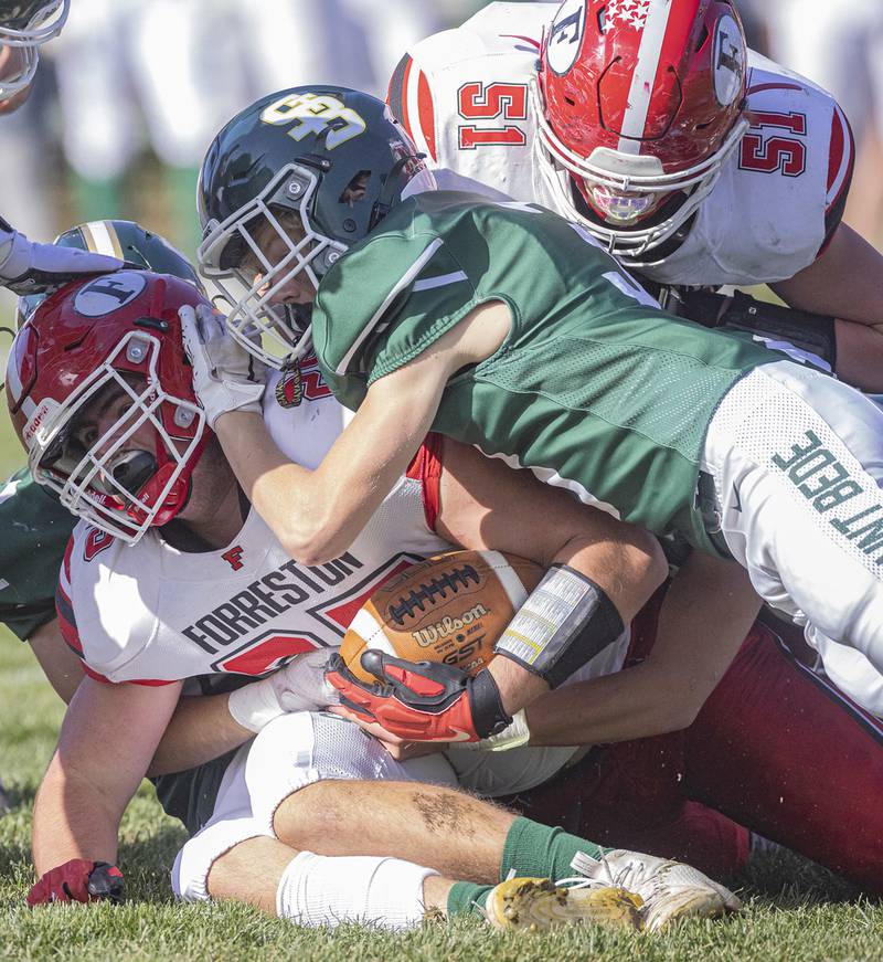 Forreston's running back Johnathen Kobler (25) is brought down by St. Bede's Hunter Savage (3) during the Class 1A first round playoff game on Saturday, Oct. 29, 2022 at the Academy in Peru.