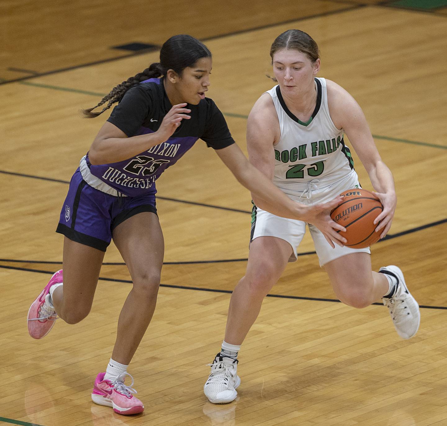 Dixon’s Ahmyrie McGowan goes for a steal against Rock Falls’ Claire Bickett Wednesday, Jan. 31, 2024 at Rock Falls High School.
