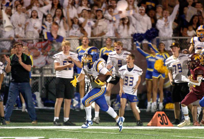 Johnsburg’s Ryan Franze heads for the end zone on a touchdown run in varsity football action on Friday, Sept. 13, 2024, at Richmond-Burton High School in Richmond.