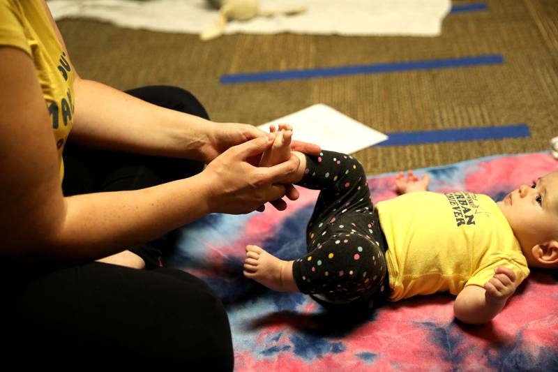 Kristen Calvallo of Hanover Park and her daughter, Kalylah, 5 months, participate in a baby yoga class at Northwestern Medicine Central DuPage Hospital in Winfield.