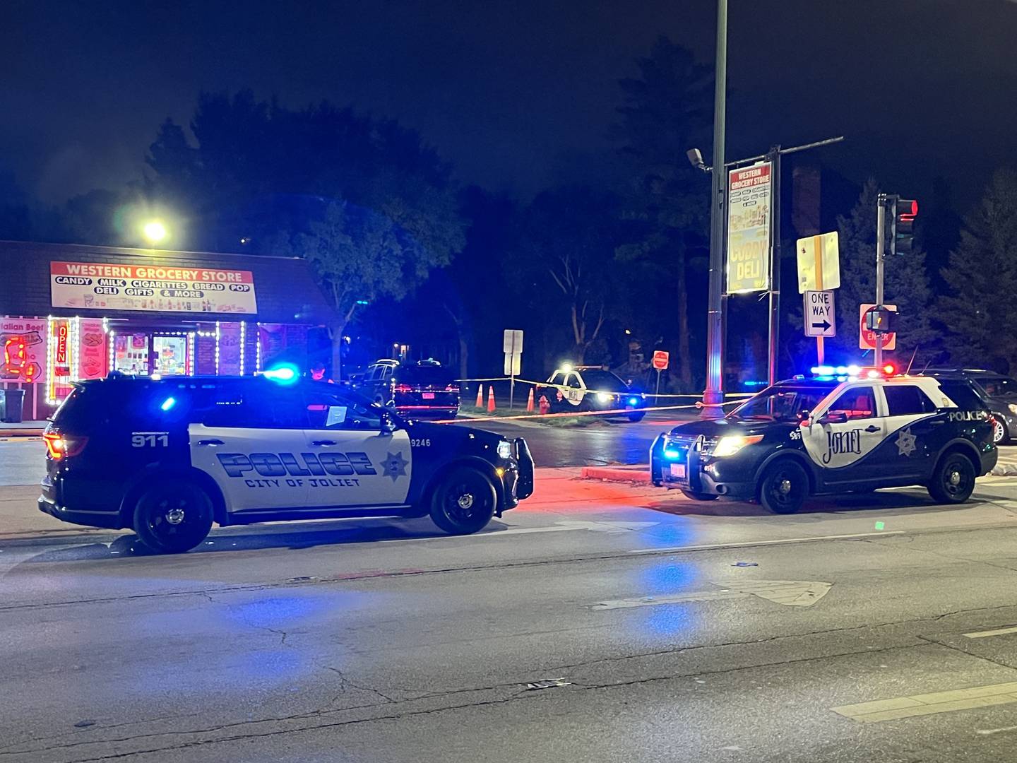 Joliet police investigate the scene of a shooting at Western Avenue and Hickory Street on Wednesday, Aug. 28, 2024.  Police say two people were shot.