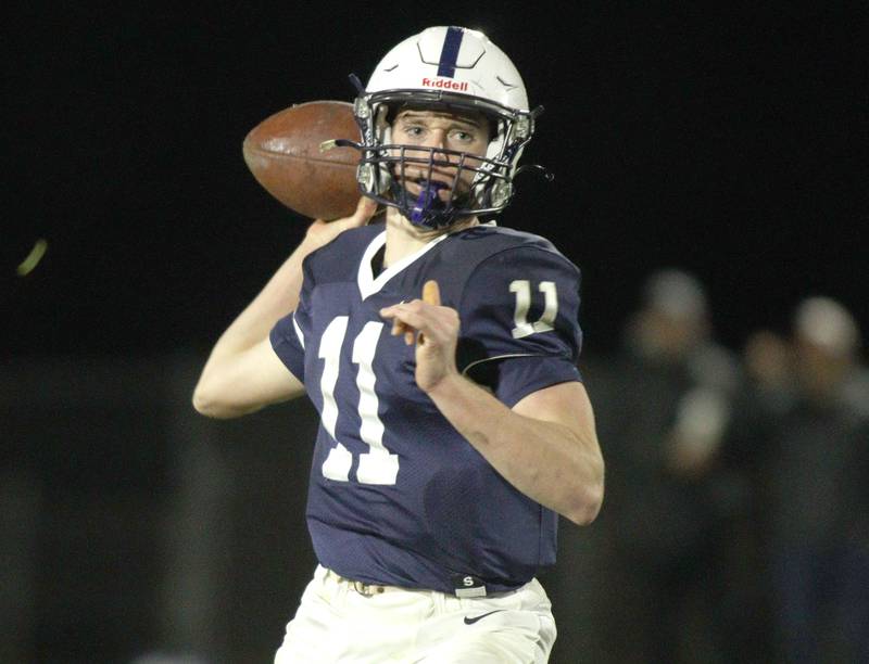 Cary-Grove’s Peyton Seaburg makes a pass against Libertyville in first-round Class 6A playoff  football action at Cary Friday.