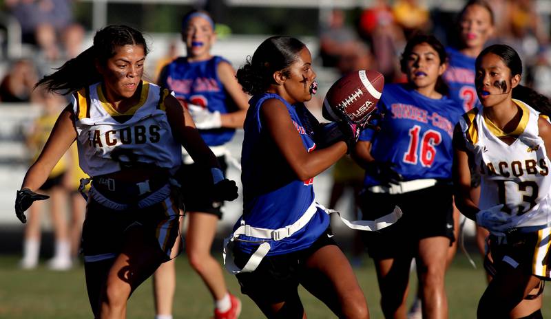 Dundee-Crown’s Taiyah Boddie Thomas reels in a pass against Jacobs in varsity flag football on Tuesday, Sept. 3, 2024, at Dundee-Crown High School in Carpentersville.