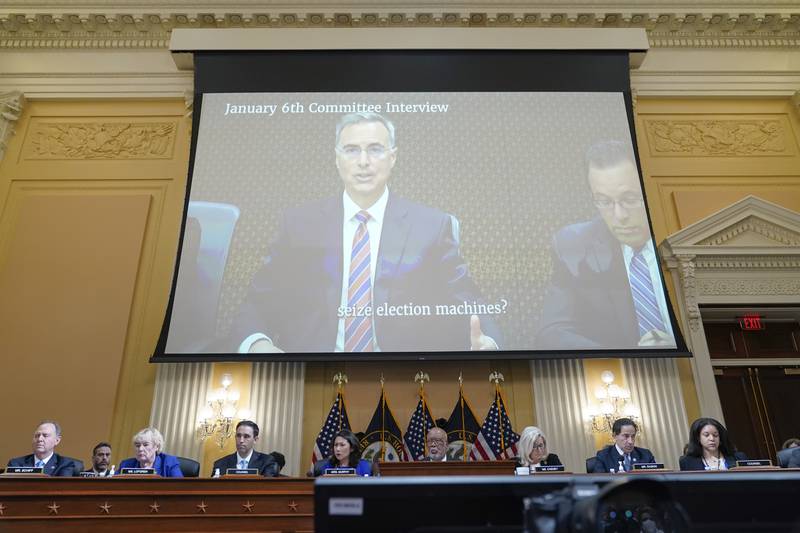 A video of Pat Cipollone, former White House counsel, is displayed as the House select committee investigating the Jan. 6 attack on the U.S. Capitol holds a hearing at the Capitol in Washington, Tuesday, July 12, 2022. (AP Photo/Jacquelyn Martin)