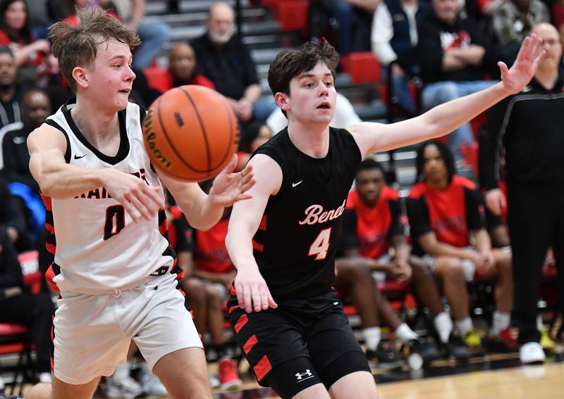 Bolingbrook's Trey Brost (0) passes as Benet's Patrick Walsh (4) defends during a Class 4A East Aurora Sectional semifinal game on Feb. 27, 2024 at East Aurora High School in Aurora.