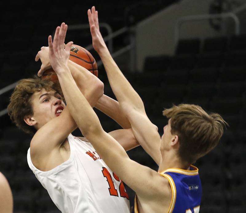 McHenry's Caleb Jett is fouled by Johnsburg's Gavin Groves as trie to shoot the ball during a non-conference basketball game Sunday, Nov. 27, 2022, between Johnsburg and McHenry at Fiserv Forum in Milwaukee.