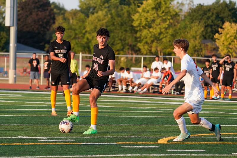 Yorkville's Lukas Kleronomos (10) plays the ball above the box against Oswego during a soccer match at Yorkville High School on Tuesday, Sep 17, 2024.