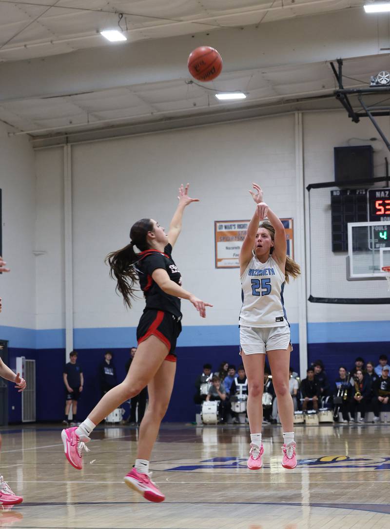 Nazareth’s Amalia Dray (25) takes a deep shot against Benet during a girls varsity basketball game on Monday, Jan. 29, 2024 in La Grange Park, IL.