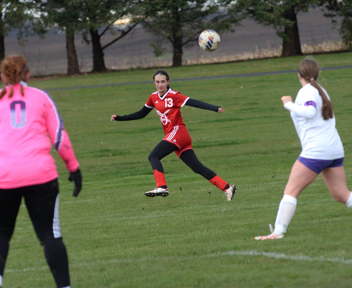 Oregon's Sarah Eckardt (13) watches the ball after centering a pass against Rockford Lutheran on Thursday, April 4, 2024 at Oregon Park West.