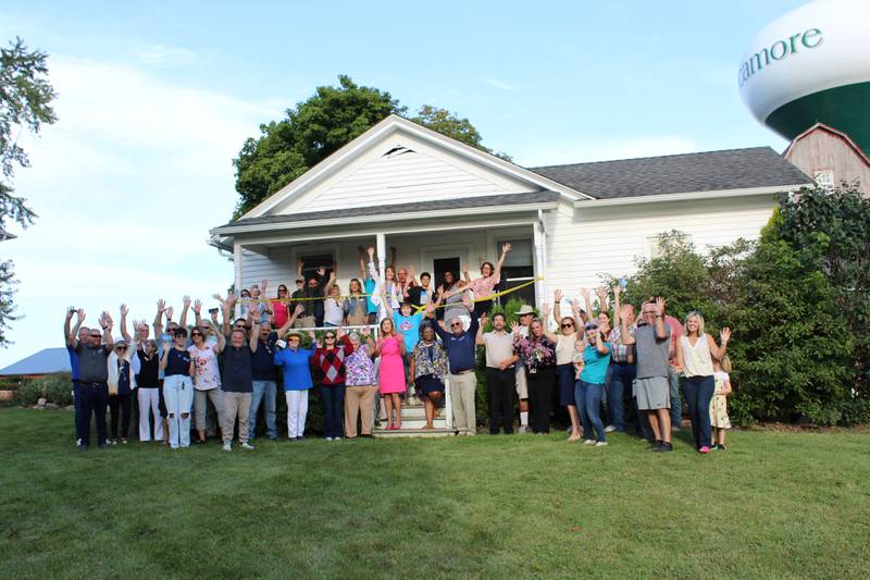 The DeKalb Chamber of Commerce celebrating Habitat for Humanity of DeKalb County's “Hired Hands House" completion