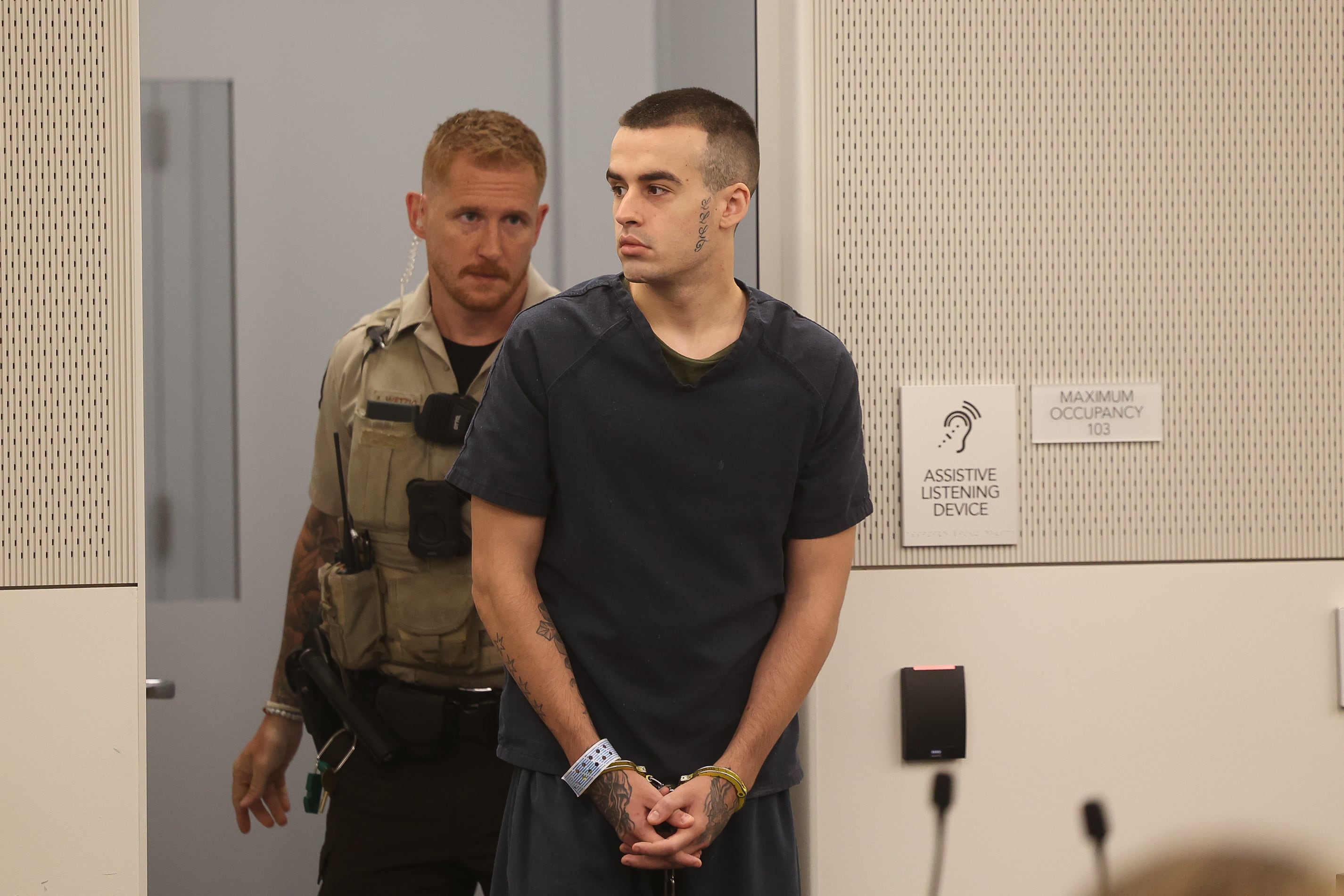 Jon Hansen, 24-year-old Shorewood resident, looks to the court gallery as he enters for an arraignment at the Will County Courthouse on Thursday June 27, 2024 in Joliet. Hansen was arrested in May in connection with the Joliet murder spree that left 8 people dead in January.