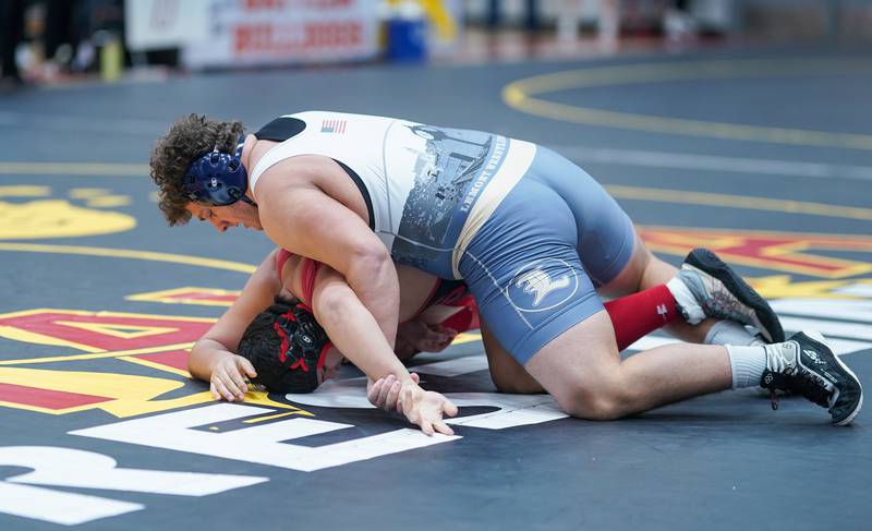 Lemont’s Alex Pasquale (top) competes against Maine South’s Tyler Fortiswith In a 285-pound championship match during The Clint Arlis Invitational Wrestling meet at Batavia High School in Batavia on Saturday, Jan 13, 2024.