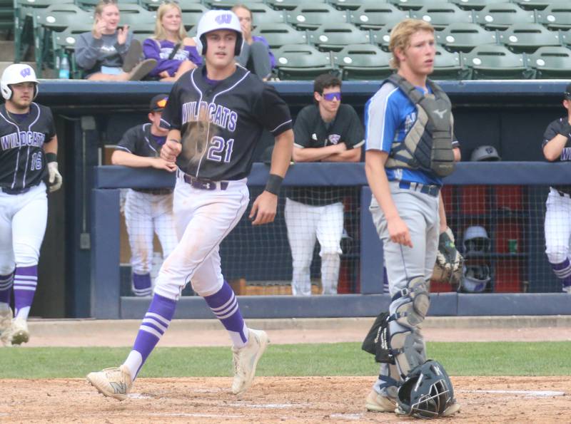 Wilmington's Lucas Rink scores a run as Newman catcher Daniel Kelly watches the play during the Class 2A third place game on Saturday, June 1, 2024 at Dozer Park in Peoria.