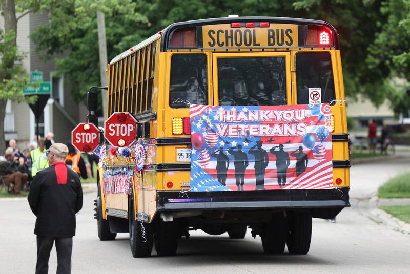 A bus brings up the rear of the the DeKalb Memorial Day parade Monday, May 27, 2024, as it heads to Ellwood House where a ceremony was held wrapping up the day’s events.