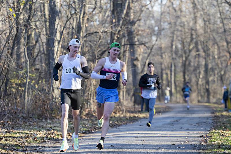 Lead runners make a turn to head down toward the river Thursday, Nov. 23, 2023 during St. Anne’s Turkey Trot at Lowell Park.