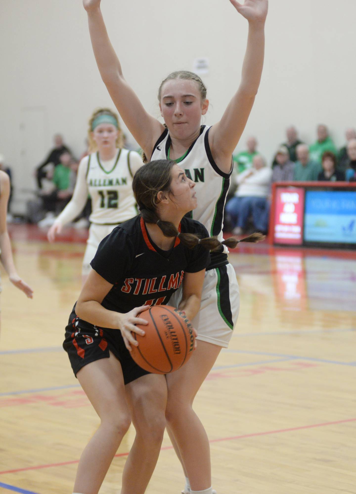 Stillman Valley's Josyn Nannie looks to shoot as she is guarded by a Rock Island Alleman defender during the championship of the 2A Oregon Sectional on Thursday, Feb. 22, 2024 at the Blackhawk Center at Oregon High School. The Cardinals lost the game 45-46.