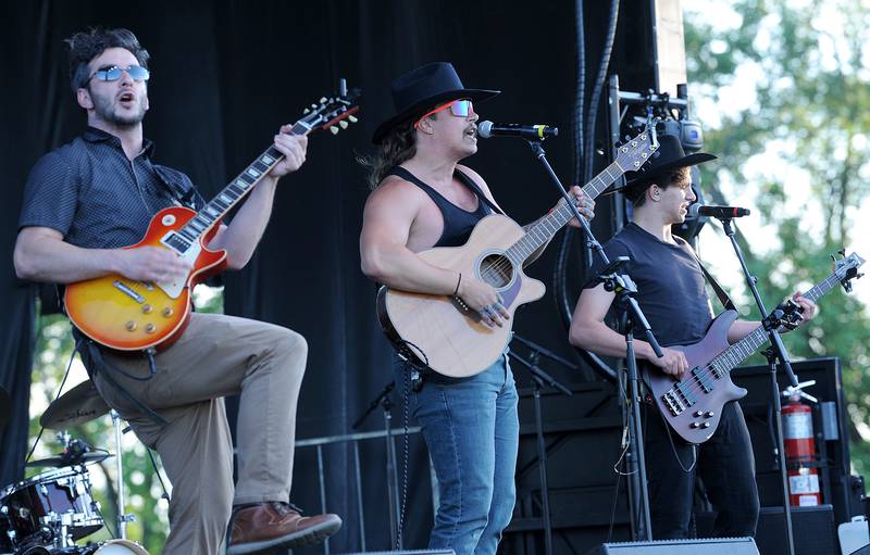 Members of the Cowboy Co Country Music Show perform on the Main Stage during the Oswegoland Park District's PrairieFest on Friday, June 14, 2024.