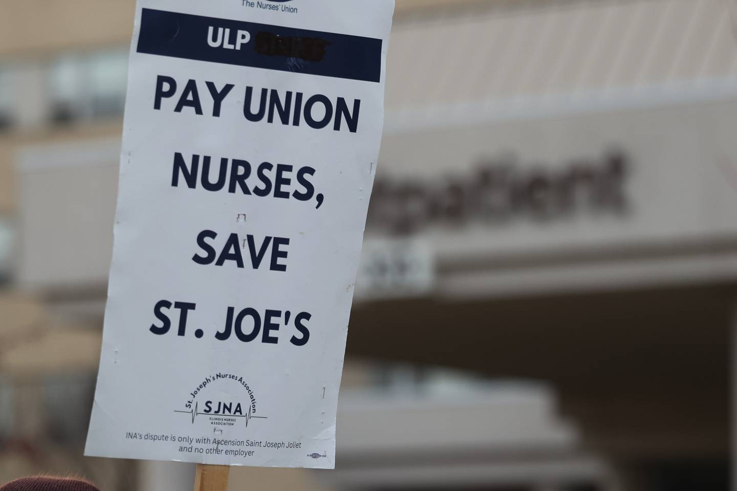A group of nurses along with the Warehouse Workers for Justice picket outside Ascension Saint Joseph Hospital in Joliet on Wednesday, Dec. 6th, 2023.