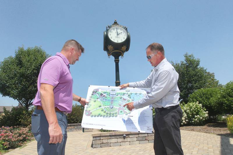 Mark Sural, business development manager, and Jim Keim, village administrator, look at the plan rendering of the Downtown Community Open Space Redevelopment Project in front of the village clock close to the construction site of the village owned property at Main & Orchard in Antioch on July 10th, 2023.
Candace H. Johnson for Shaw Local News Network