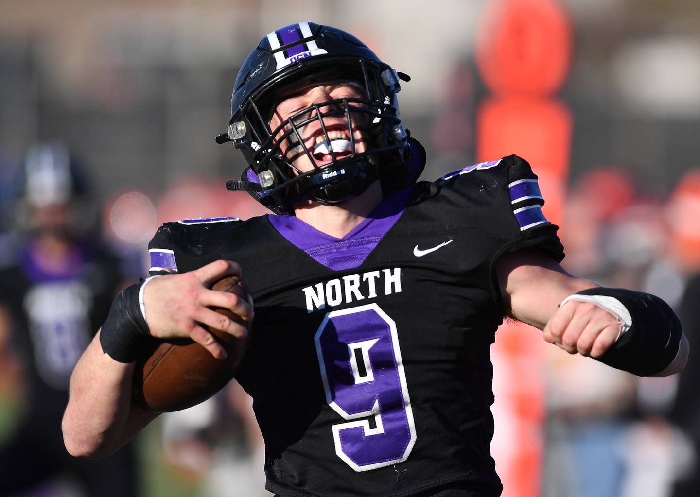 Downers Grove North's Jimmy Janicki reacts in the end zone after his "pick six" interception for a touchdown during an IHSA Class 7A semifinal game against Normal Community on Nov. 18, 2023 at Downers Grove North High School in Downers Grove .