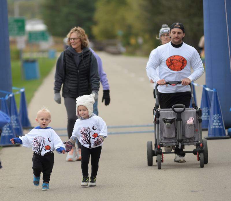 The Gale family of Oregon start the 5K during Autumn on Parade on Sunday, Oct. 8, 2023 in Oregon. Pictured are Grayson, 2, Wynter, 4 and their parents Dan and Cori along with grandma Deb.