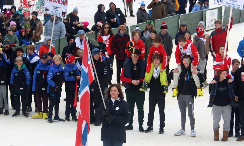 Teams line up for opening ceremonies during the 119th Norge Annual Winter Ski Jump Tournament in Fox River Grove Sunday.