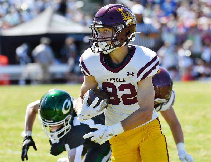 Loyola's Robert Clingan turns to the end zone after catching a touchdown pass against Glenbard West during a game on September 7, 2024 at Glenbard West High School in Glen Ellyn.