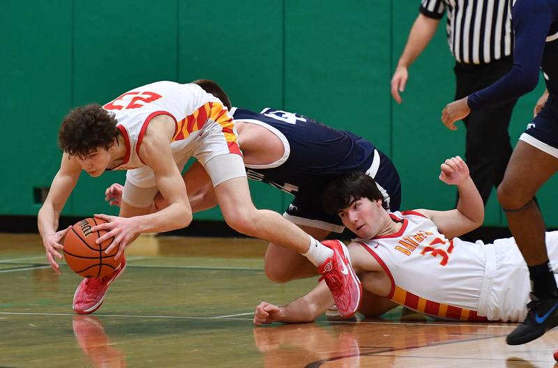 Batavia's Jax Abalos grabs a loose ball during a Jack Tosh Classic game against Downers Grove South on Dec. 26, 2023 at York High School in Elmhurst.