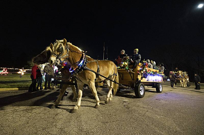 Northern Star Farms of Poplar Grove provided two horse-drawn carriages to shuttle passengers through the lighted display Saturday, Nov. 25, 2023 in Rock Falls. Going forward, visitors can drive through the display to see the sights.