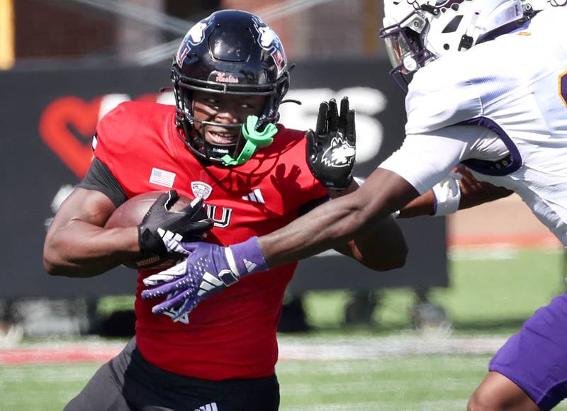 Northern Illinois' Antario Brown tries to shed the tackle of Western Illinois' Willie Jones during their game Saturday, Aug. 31, 2024, in Huskie Stadium at NIU in DeKalb.